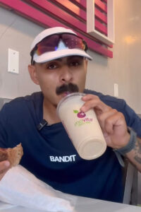 Social media influencer drinking smoothie