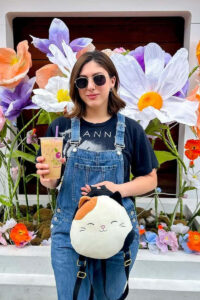 Social media influencer holding cold brew coffee