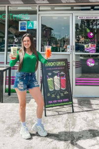 Social media influencer holding two juices