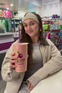 Social media influencer holding smoothie