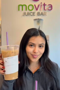 Social media influencer holding cold brew coffee