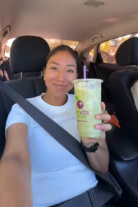 Social media influencer holding smoothie