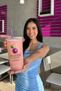 Social media influencer holding smoothie