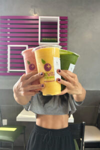 Social media influencer holding smoothies