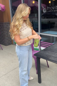 Social media influencer holding smoothie