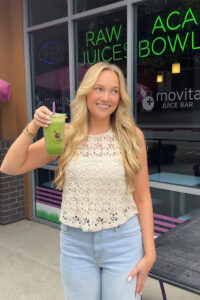 Social media influencer holding smoothie