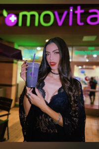 Social media influencer holding smoothie